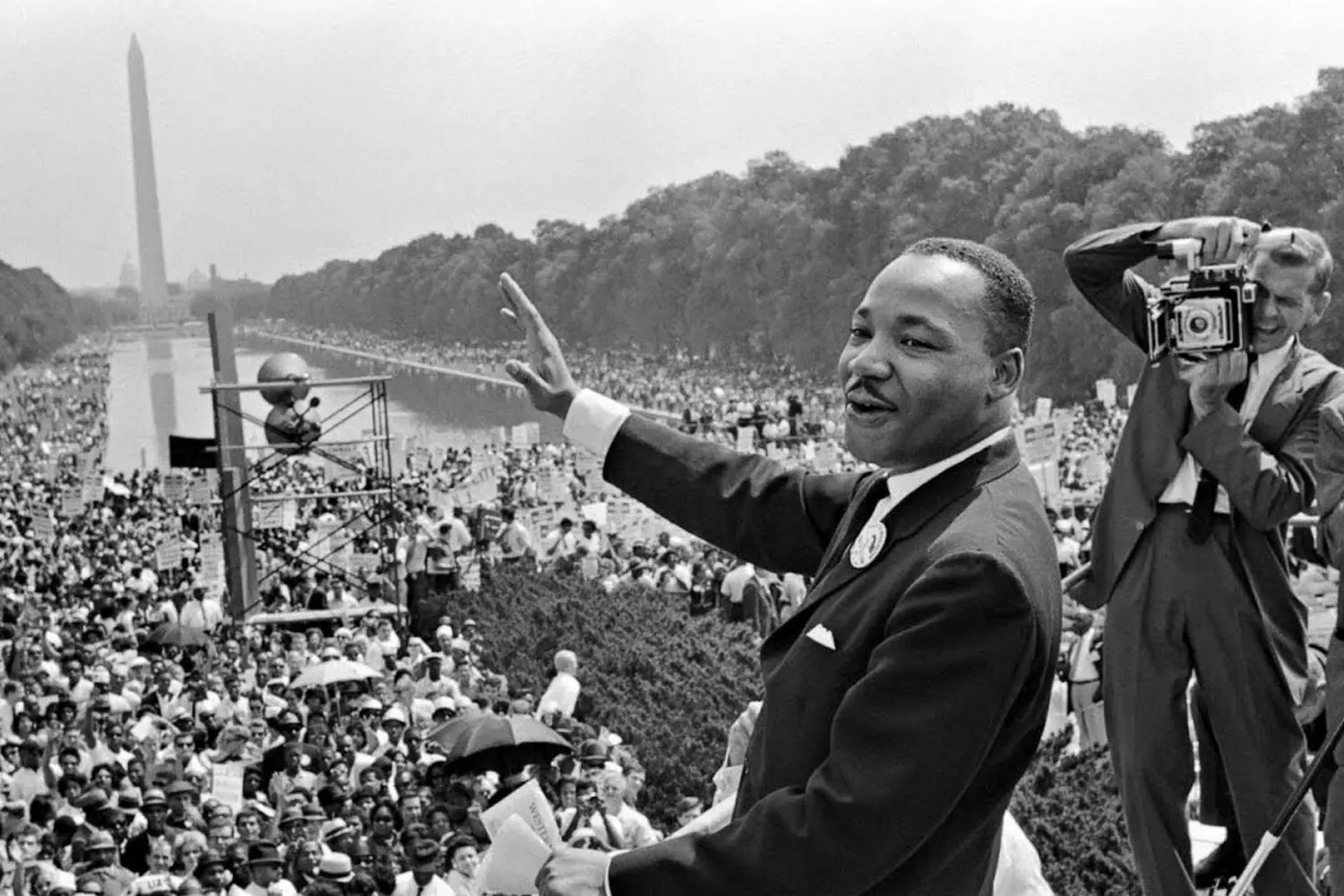 Martin Luther King Jr.: Delivering an Inspiring Speech from the Stage Martin Luther King Jr. passionately addresses an audience from a stage