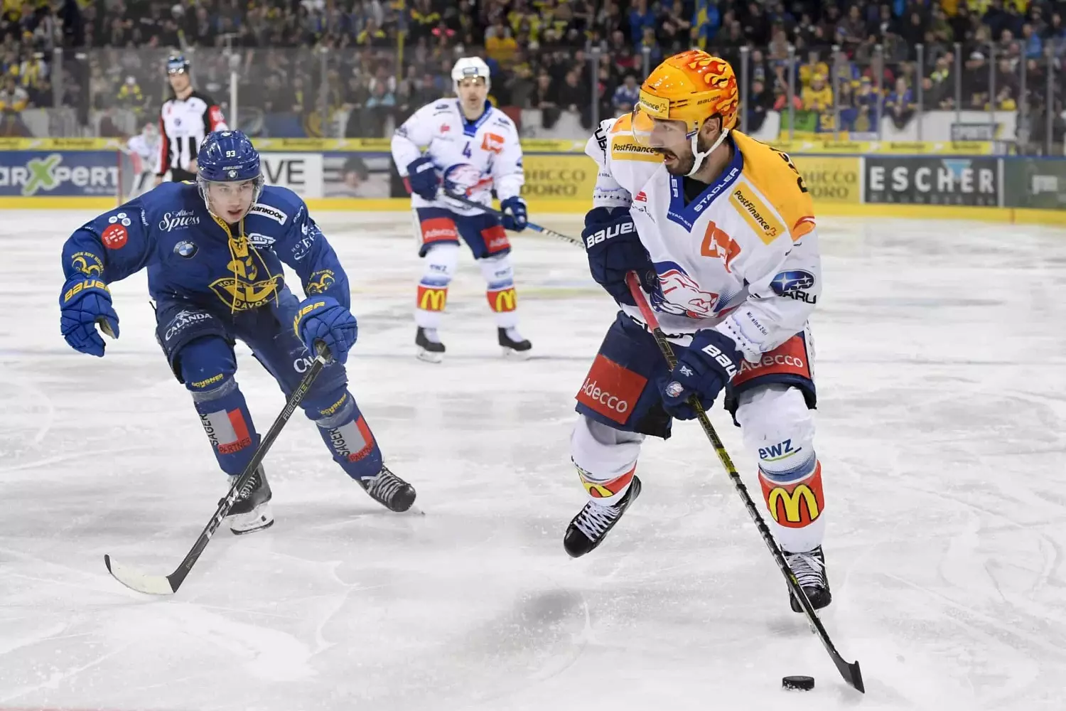 An NHL game NHL teams playing on the ice