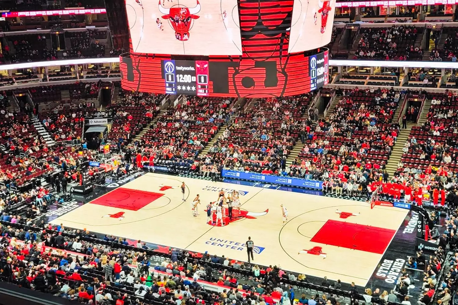 Chicago Bulls Game — NBA Action at the United Center Chicago Bulls basketball game in action at the United Center, with players competing on the court