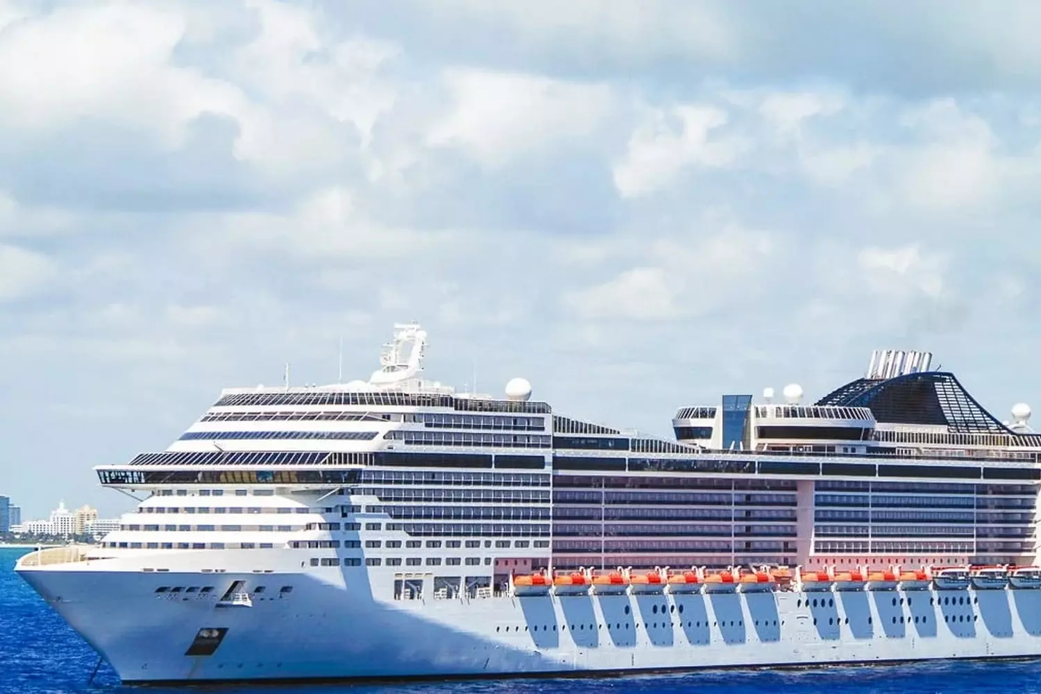 MSC Cruises — European Elegance on the High Seas MSC Cruises ship sailing near the coast