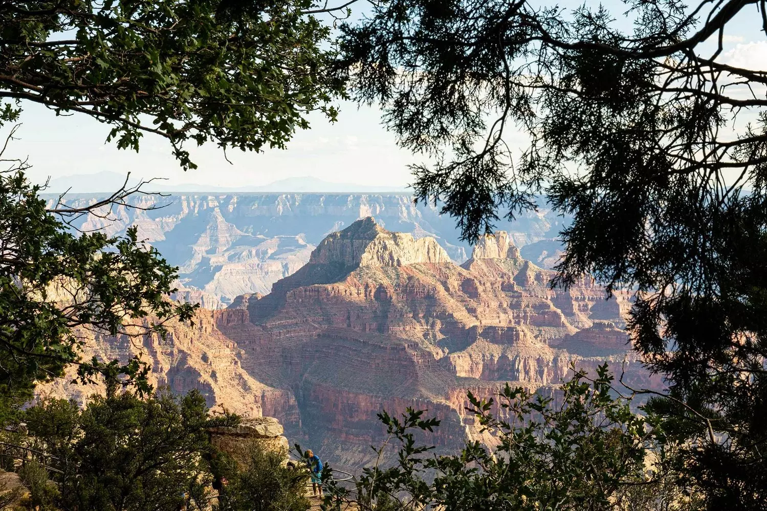 Grand Canyon's Magnificent Vistas: Nature's Masterpiece Unveiled Stunning panoramic view of Grand Canyon's colorful rock layers, deep valleys and winding Colorado River under dramatic cloud-filled sky