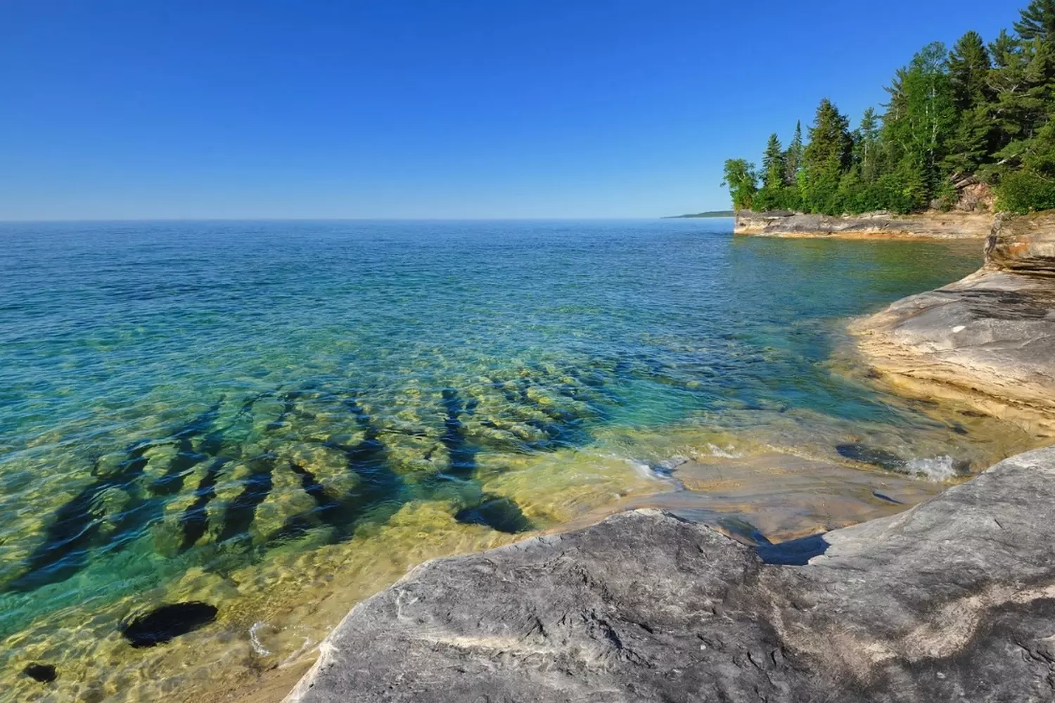 Lake Superior: The Crown Jewel of the Great Lakes Aerial view of Lake Superior, the largest and deepest of the Great Lakes, showcasing its crystal-clear blue waters and rugged shoreline