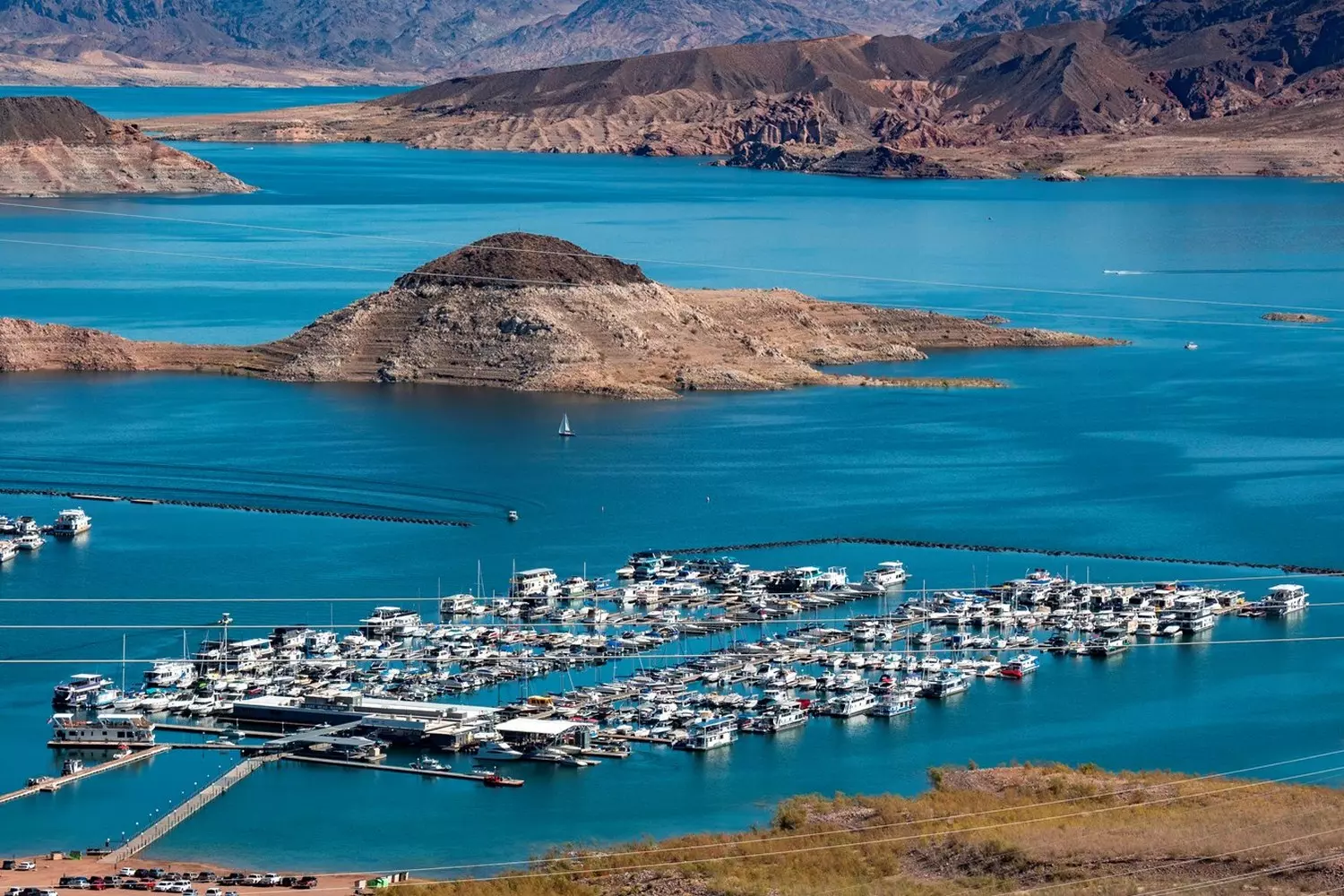 Scenic aerial photo of Lake Mead marina in Nevada Aerial view of Lake Mead marina surrounded by deep blue water and desert cliffs