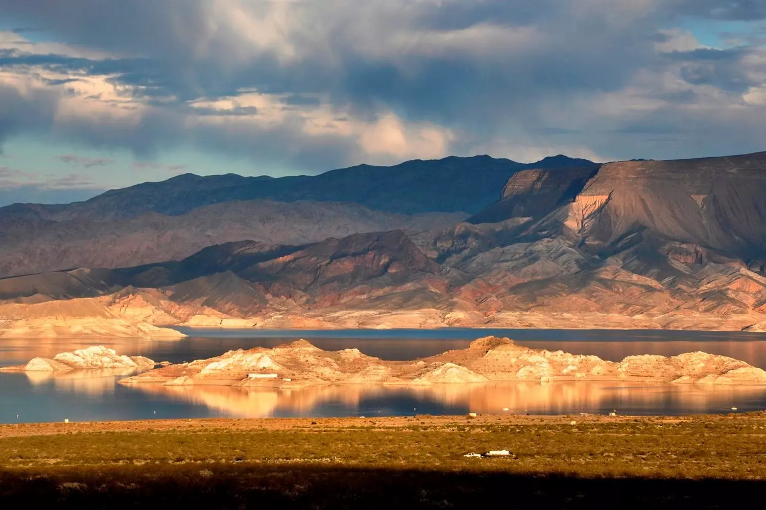 Breathtaking sunset at Lake Mead, Nevada Sunset over Lake Mead with golden light reflecting on the water and desert hills