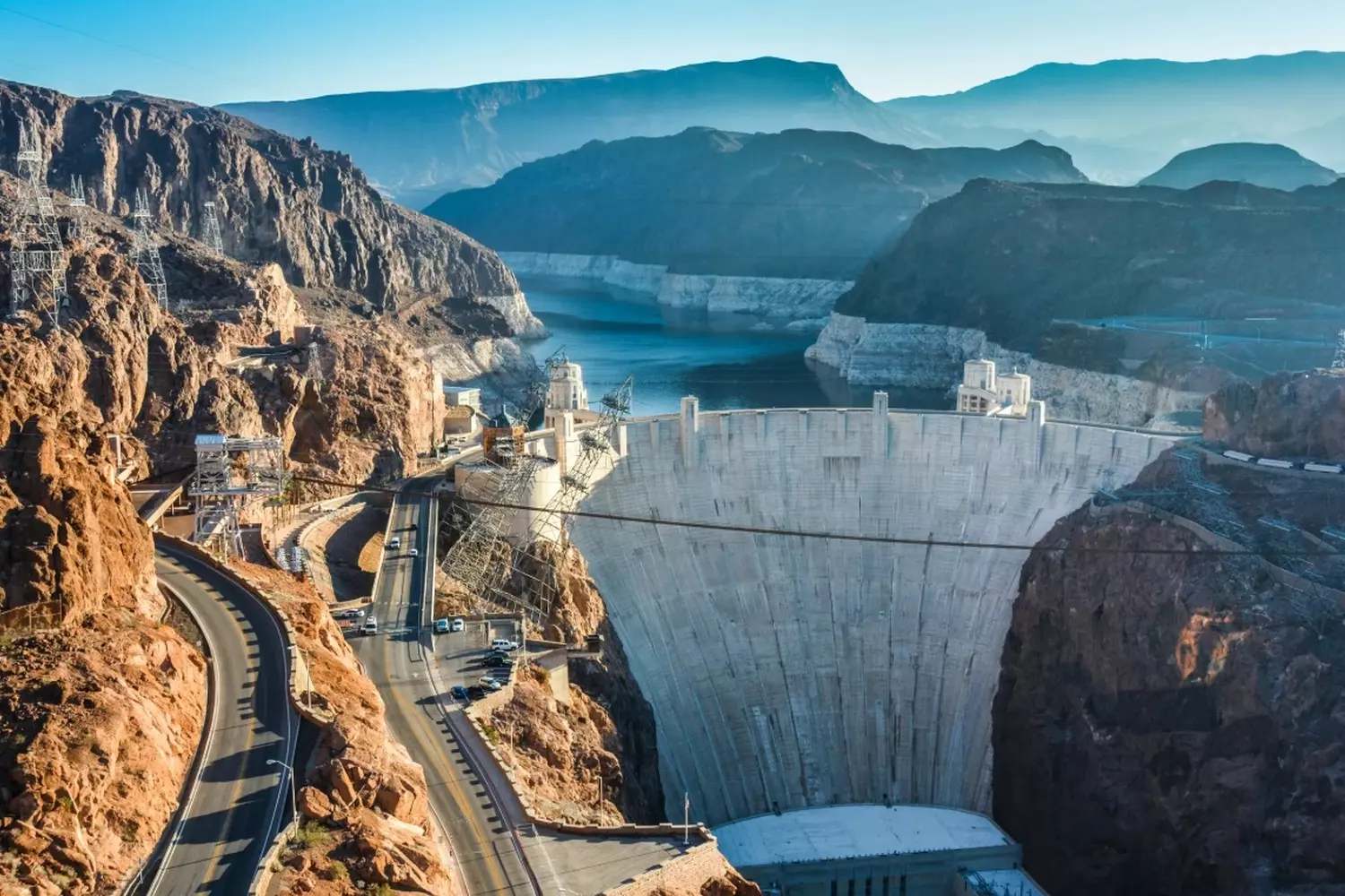 Impressive Hoover Dam and Lake Mead seen from above Aerial view of Hoover Dam with Lake Mead stretching into the desert landscape