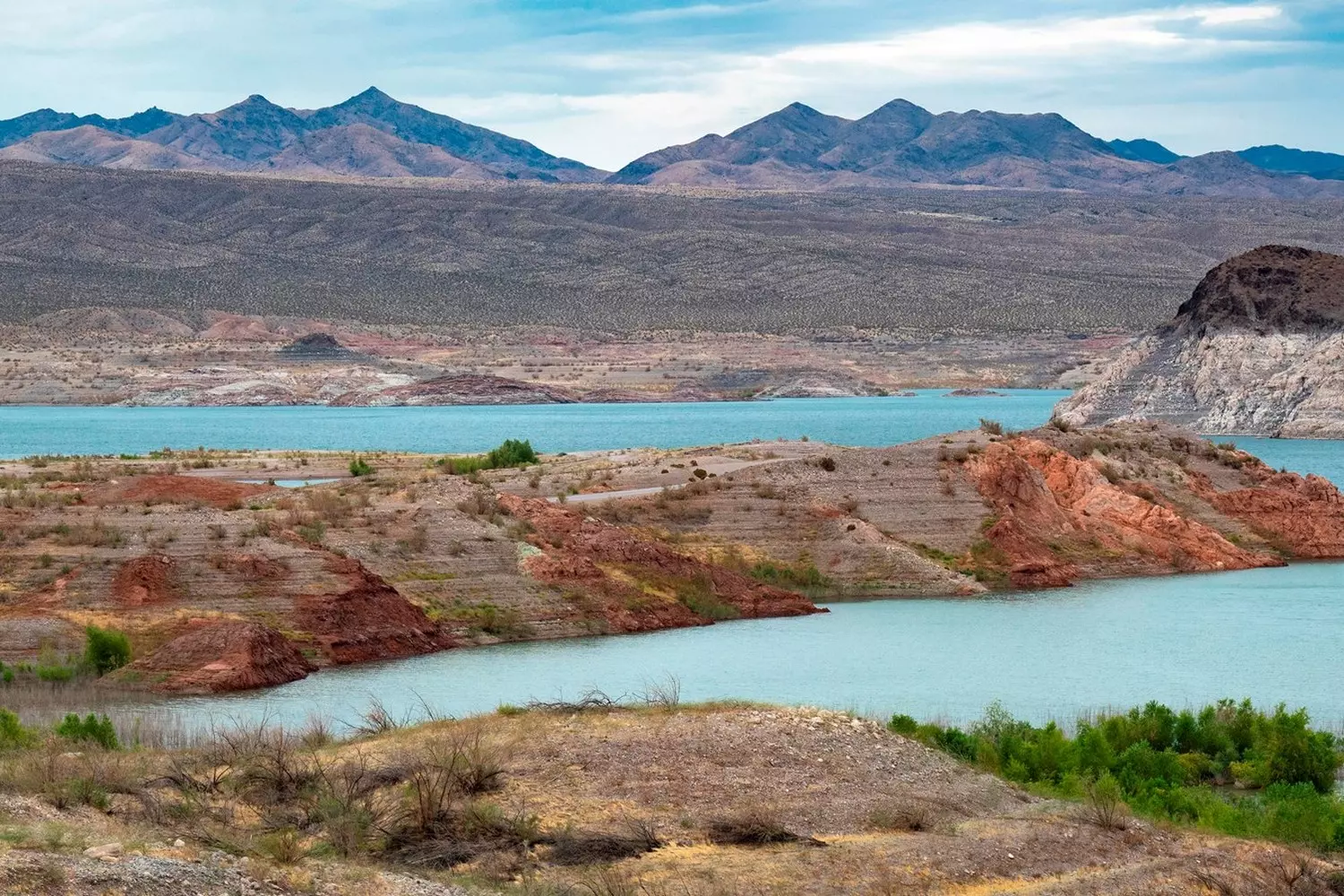 Lake Mead in Nevada — the largest reservoir in the United States Panoramic view of Lake Mead with blue water and surrounding desert hills