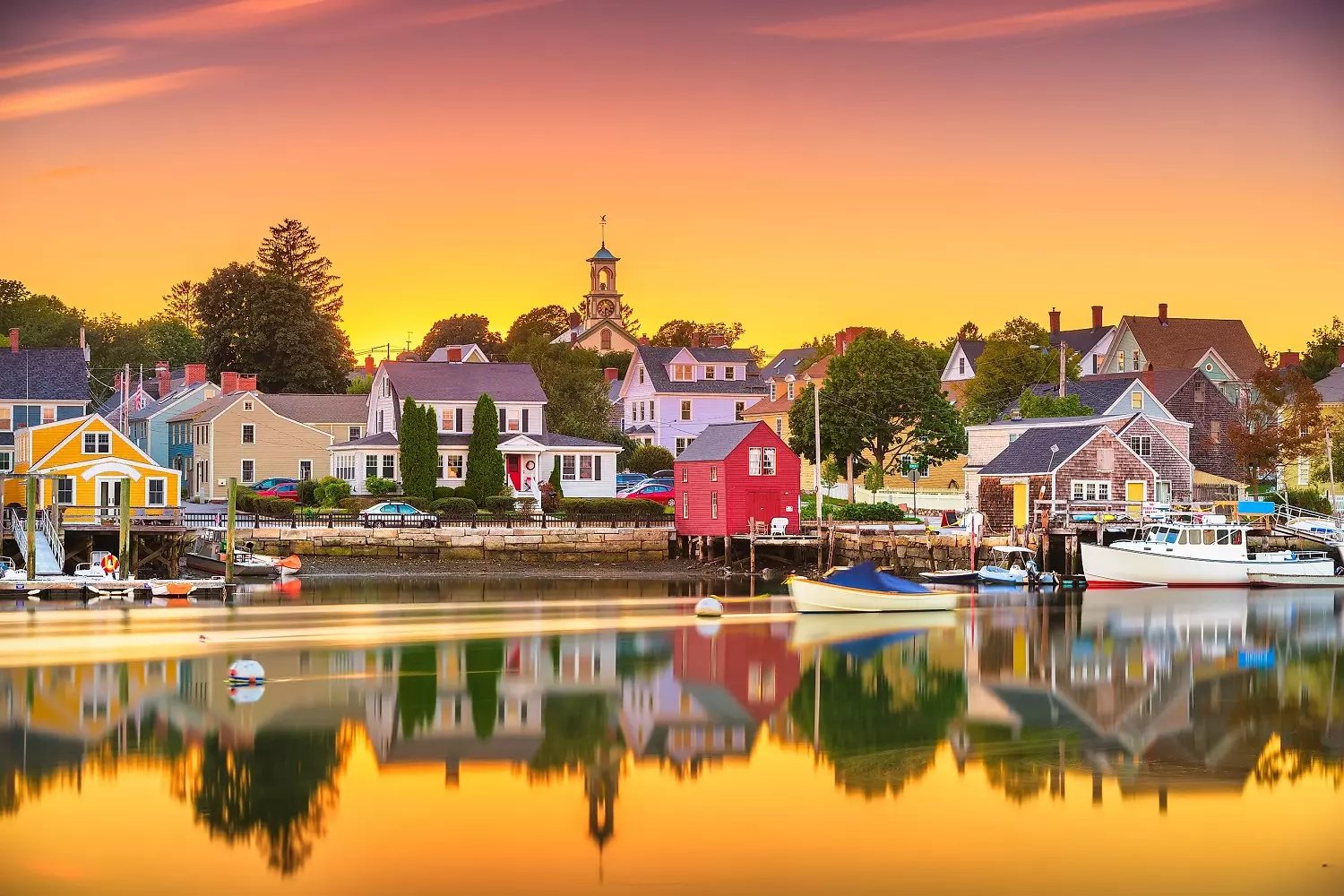 New England with an orange sky backdrop One of the towns in New England