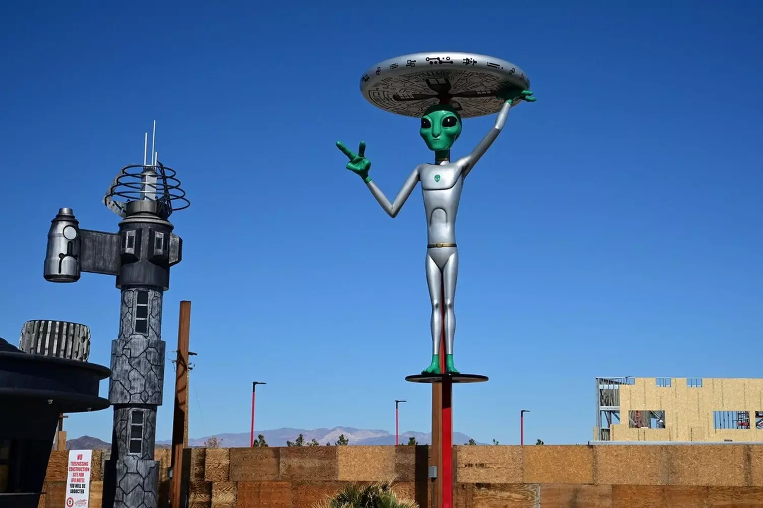 Area 51 Museum: Nevada's Quirkiest UFO & Military History Exhibit Exterior of the Area 51 Museum with UFO-themed displays and alien figurines visible through windows