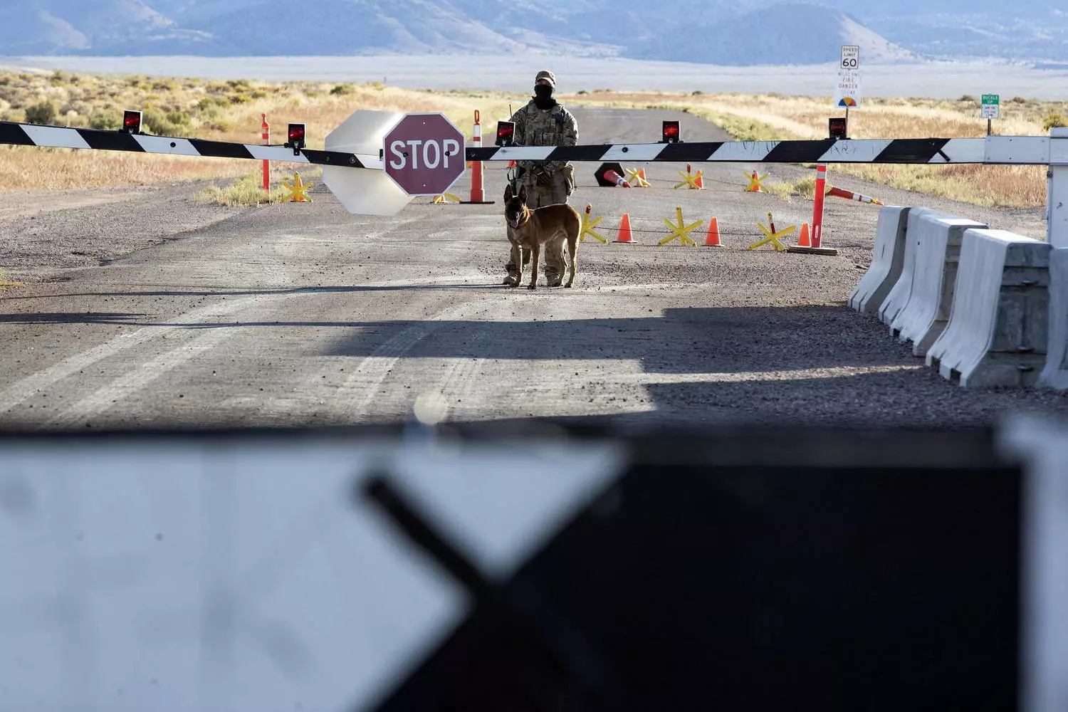 Area 51 Warning Sign: The Chilling Military Notice That Guards America's Secrets Official Area 51 warning sign with bold red letters saying 'Restricted Area — Use of Deadly Force Authorized' against desert background