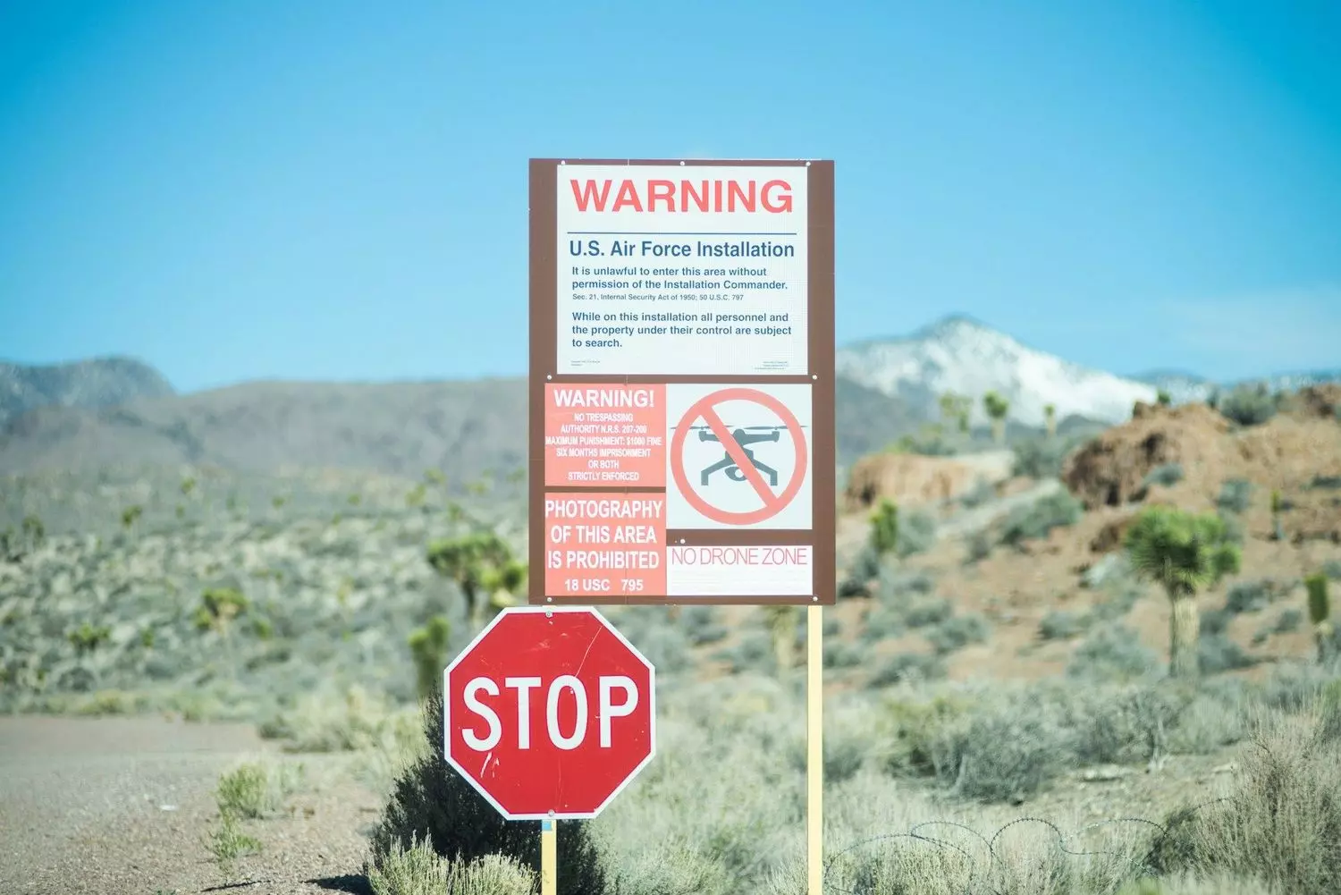 Area 51 Warning Sign: The Chilling Military Notice That Guards America's Secrets Official Area 51 warning sign with bold red letters saying 'Restricted Area — Use of Deadly Force Authorized' against desert background